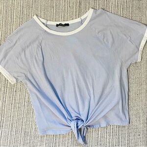 light blue cropped/tied t-shirt